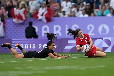 Canada's Alysha Corrigan score a try